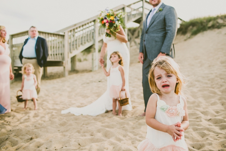 Flower girl crying at wedding