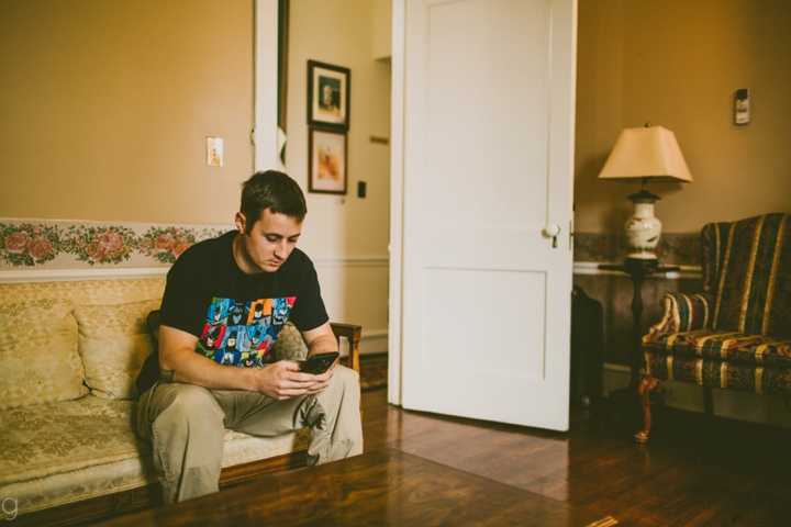 Groom on phone before wedding